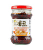 A glass jar of Laoganma Oil Chili Condiment with Sweet Mushroom, featuring a red lid and a white label with Chinese characters and English text, set against a plain white background.