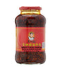 Bottle of spicy chili paste with a red label on a white background
