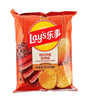A bag of Lay's Texas Grilled BBQ Flavor Real Potatoes potato chips in its original red packaging with a yellow and red Lay's logo.