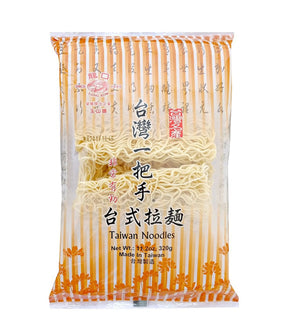 Packaged Long Kow Taiwan Ramen Noodles, showing the noodles through the transparent window.