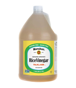 A large plastic bottle of Marukan Genuine Brewed Rice Vinegar with a green and white label, indicating it is sugar-free and sodium-free.