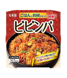 Packaged instant rice dish with vegetables and meat on a red background