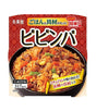 Packaged instant rice dish with vegetables and meat on a red background