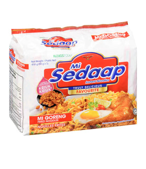Mi Sedaap instant noodles packaging with images of noodles and fried chicken on a white background