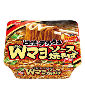 Packaging for Nissin Dekauma Double Mayonnaise Yakisoba Instant Fried Noodles showing the product name, image of the noodles, and additional product information in Japanese.