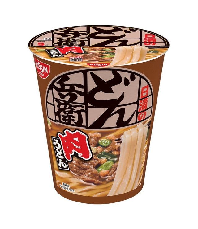 A cup of Japanese instant noodles from the brand Kusan, featuring a brown paper cup with a printed lid. The packaging displays Japanese text and an appetizing image of beef and noodles with green onions.