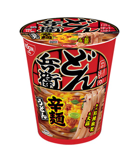 A cup of Nissin ramen noodles with spicy hot oil, featuring a red and black label with Japanese text and a bowl of noodle soup on the front.