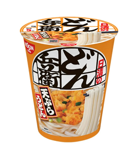 A cup of Japanese instant ramen noodles with a bright orange label featuring white noodles and a chicken and broccoli topping, on a plain white background.
