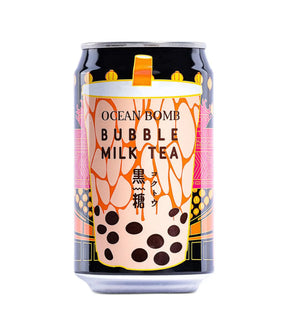 A can of Ocean Bomb Bubble Milk Tea featuring an illustration of bubble tea with brown sugar, on a background with pink and black colors.