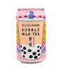 A can of Ocean Bomb Bubble Milk Tea featuring images of bubble tea components, such as tapioca pearls and boba, on a pink background.