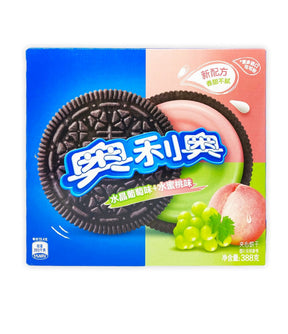 Packaging for Oreo biscuits featuring grape and peach flavors, with images of the biscuits, grapes, and peaches on the box.