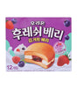 A package of Korean yogurt cake, featuring a purple box with illustrations of a strawberry and cream sandwich cake, fresh strawberries, blueberries, and whipped cream. The box has Korean text and is photographed on a clean white background.