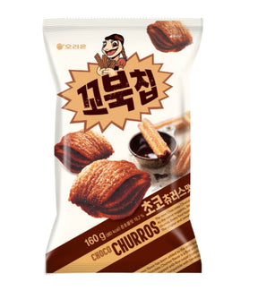 A package of Orion - Kkobuk Turtle Choco Churros 160g, displaying the product name in Korean and English, with images of chocolate covered rice cakes on the front.