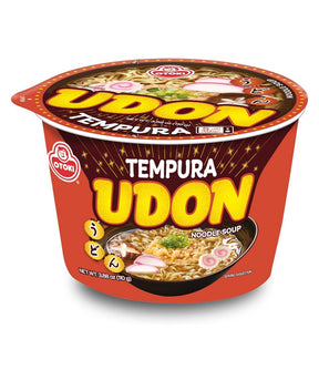 A cup of Otoki Tempura Udon Noodle Soup on a clean white background. The packaging is predominantly red with bold yellow text and a bowl of prepared noodles pictured on the front.