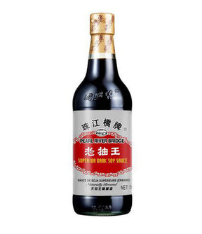 A bottle of Pearl River Bridge Superior Dark Soy Sauce 500ml with label in Chinese characters.