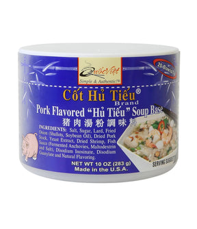 A packaged product labeled 'Quoc Viet - Pork Flavoured Hu Tieu Soup Base 284g' with branding and product information on the label.