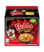 Packaging for Samyang Spicy Chicken Buldak Noodle (Stew Type) showing an illustration of a character eating noodles and flames indicating spiciness. The package indicates that there are 5 packs included.