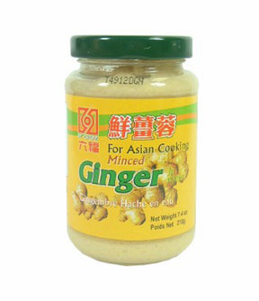 A jar of Six Fortune Minced Ginger, with product information and branding visible on the label.