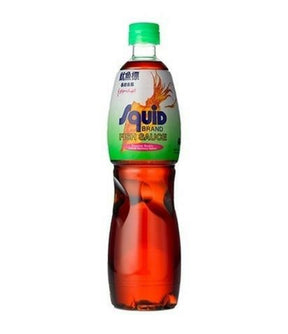 A bottle of Squid brand fish sauce, with a green cap and label, on a white background.