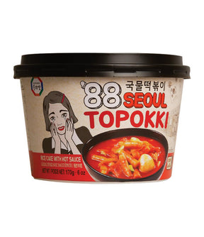 Packaging of Surasang Topokki Rice Cake with Hot Sauce featuring an illustration of a character and the product visible through a window.