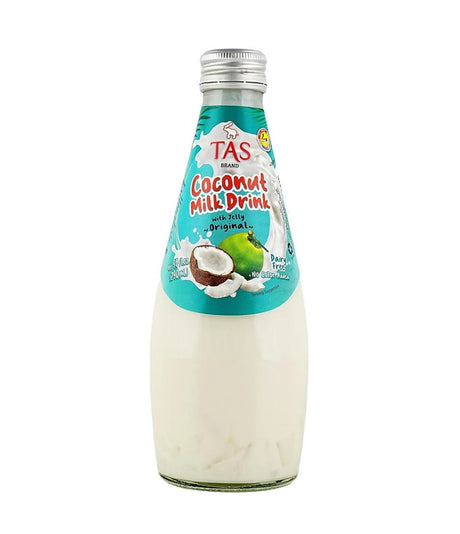 A bottle of TAS Coconut Milk Drink with milk original, featuring a white liquid inside a clear glass bottle with a teal label and silver cap, on a white background.