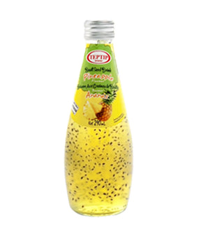 Bottle of pineapple juice with a pineapple on the label against a white background