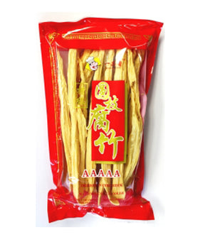 Packaged dried bean curd sticks in a red and clear plastic bag with Chinese characters printed on the label.