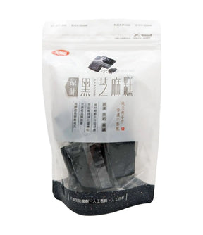Packaged black sesame cake in a clear plastic bag with labeling in Chinese and English.