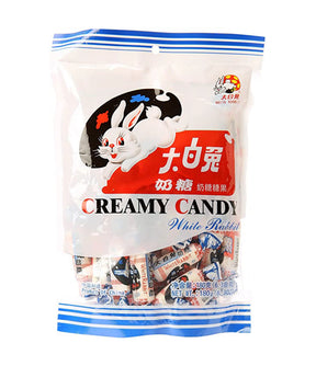 Packaging of White Rabbit Creamy Candy featuring a white rabbit illustration and Chinese characters, with a blue and white color theme.