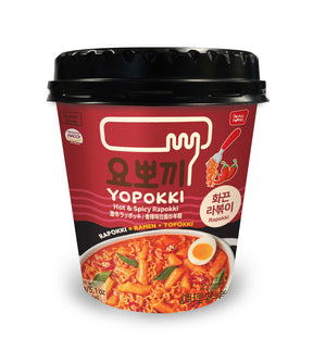 A cup of Young Poong Yopokki Hot & Spicy Rapokki instant noodle showing the product packaging with Korean text and an image of the noodles with eggs and a spicy sauce.